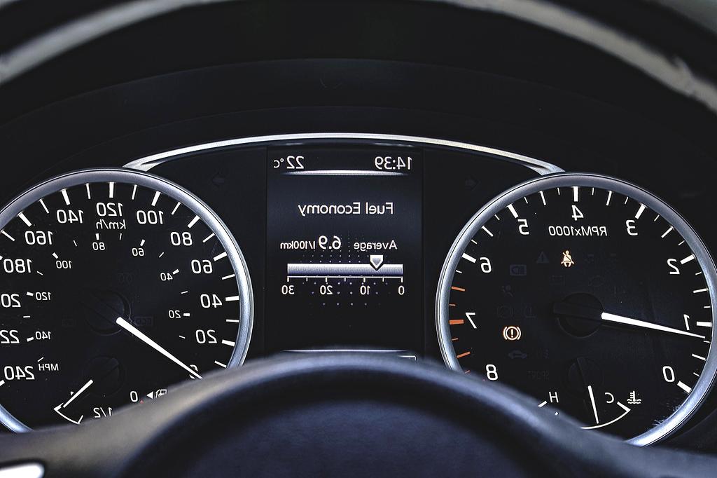 Person working on laptop with smart home dashboard